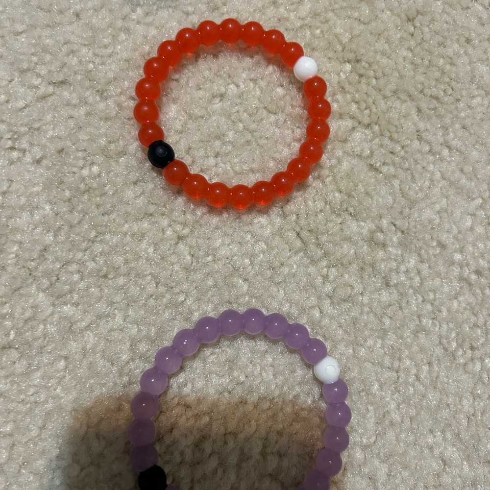 Red and Purple Lokai Bracelets